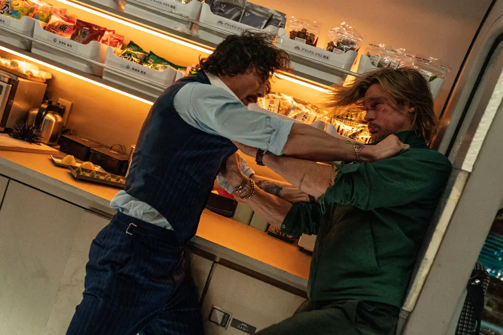 Aaron Taylor Johnson left and Brad Pitt play likable charming and extremely violent characters in